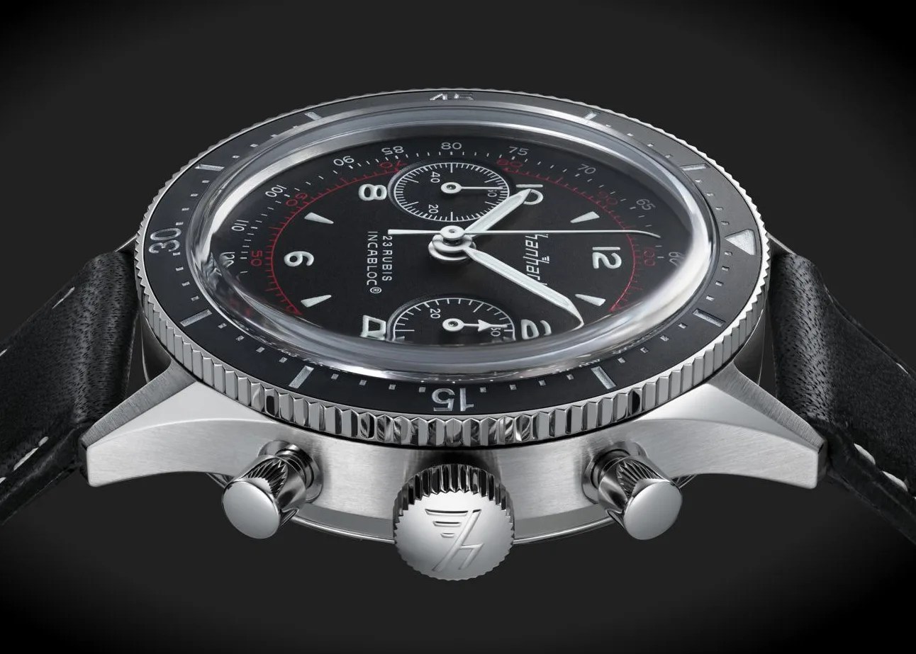 the side and crown of a back chronograph watch