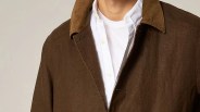 the collar and shoulders of a man in a brown jacket