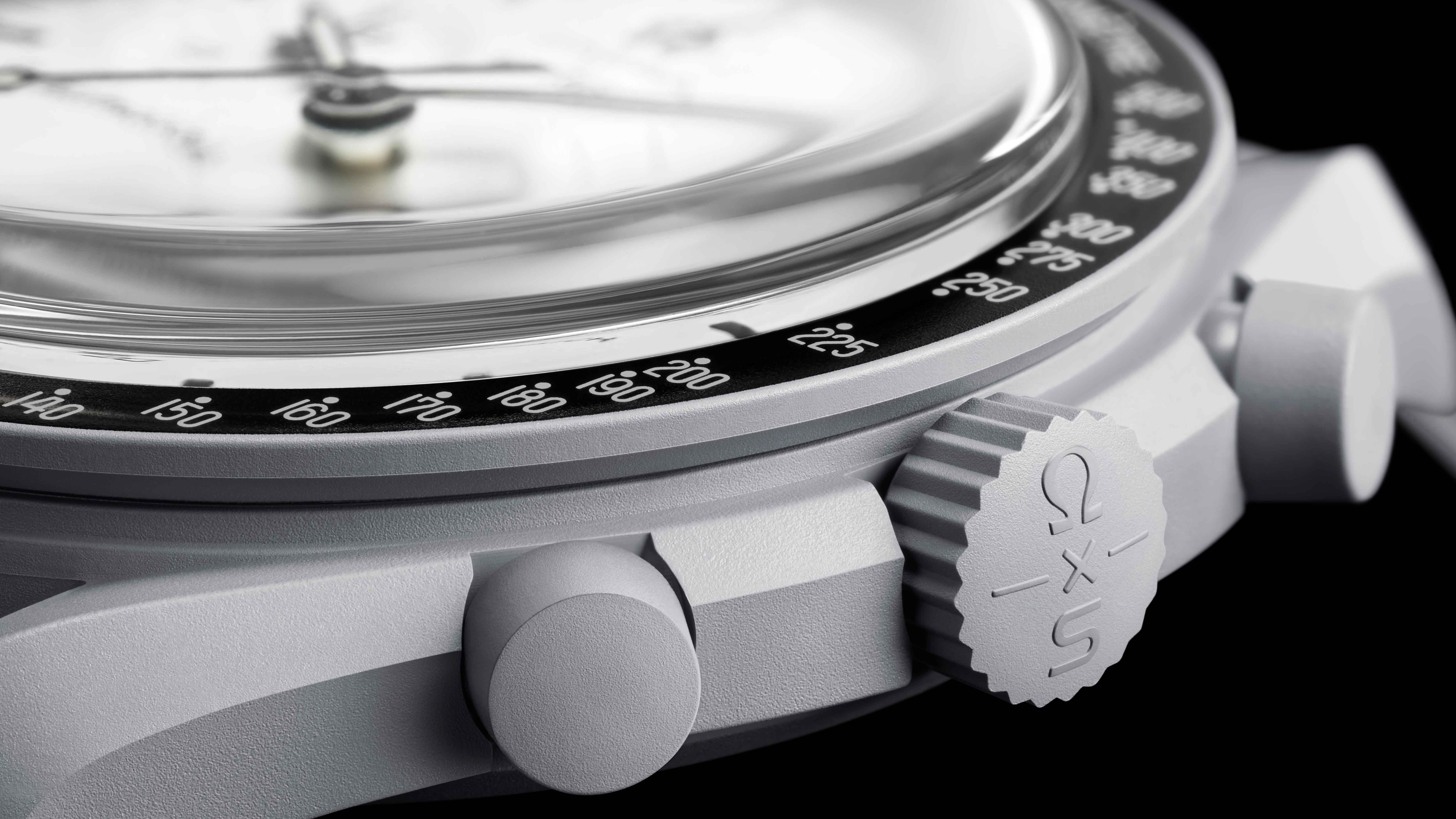 the crown and bezel of a gray watch