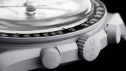 the crown and bezel of a gray watch