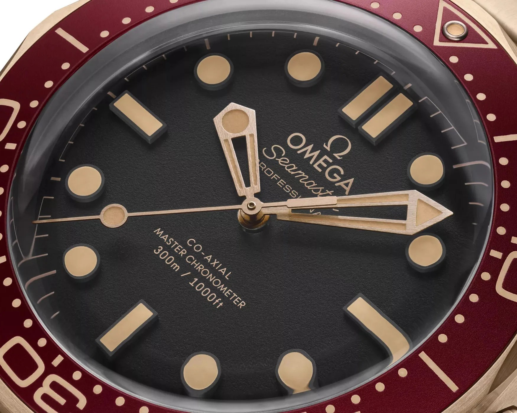 the black dial of a gold omega seamaster watch