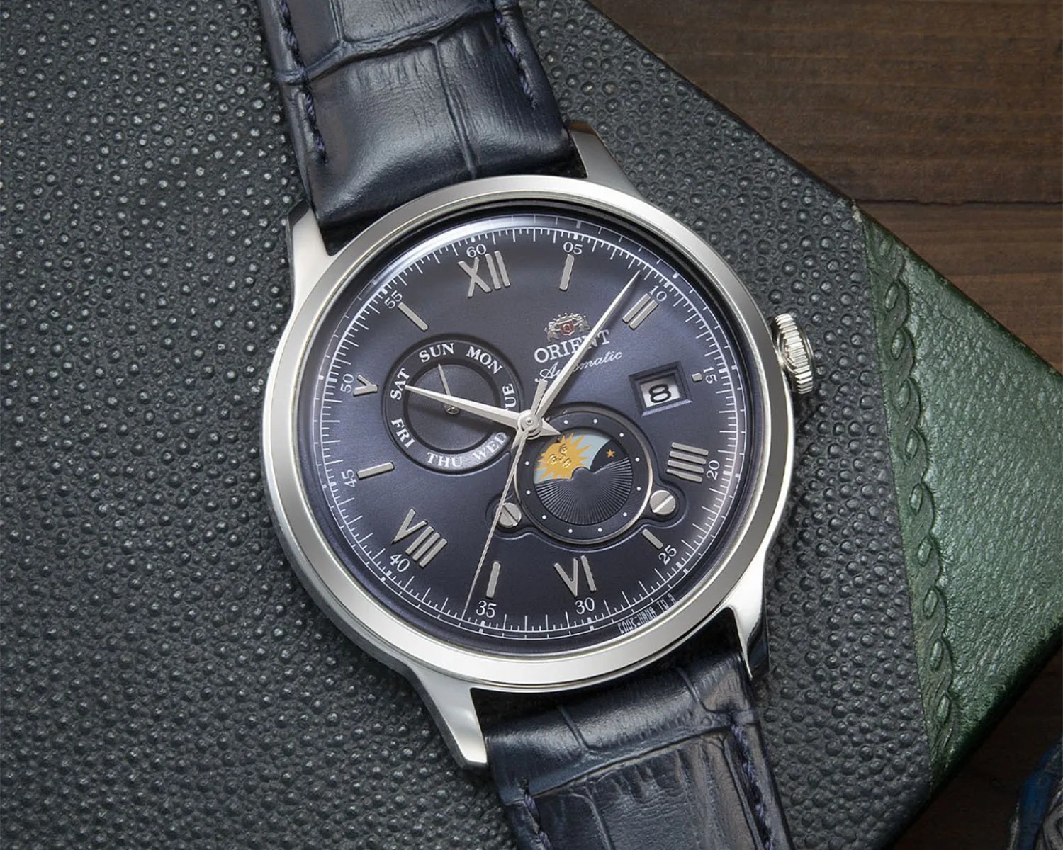 a blue dress watch with a blue band