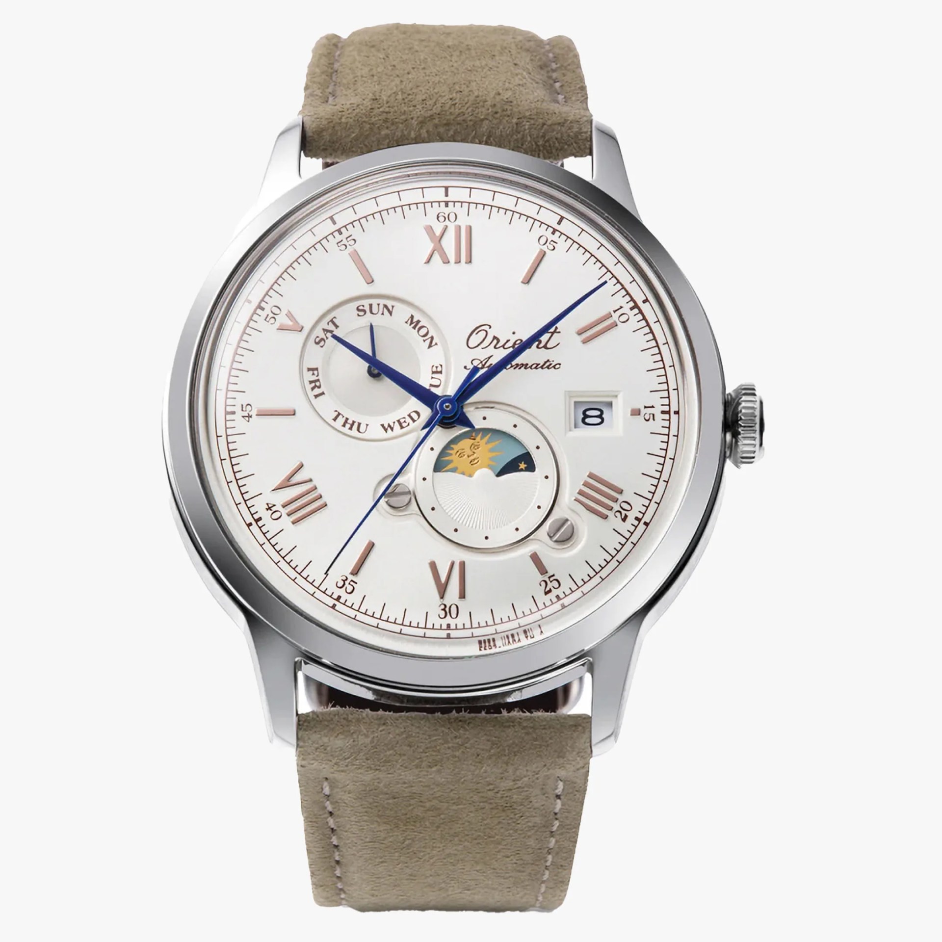 A complicated dress watch on a tan suede strap