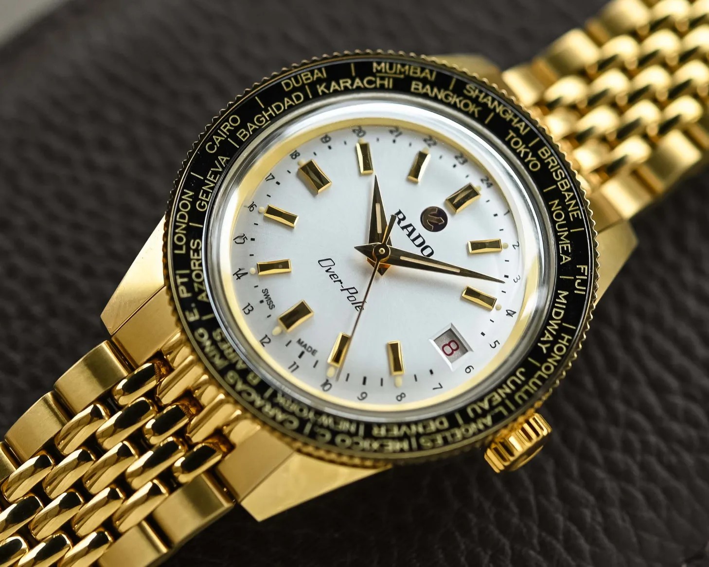 close up of the dial of a gold watch