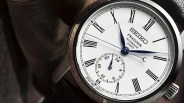 close up of a watch dial with roman numeral indices