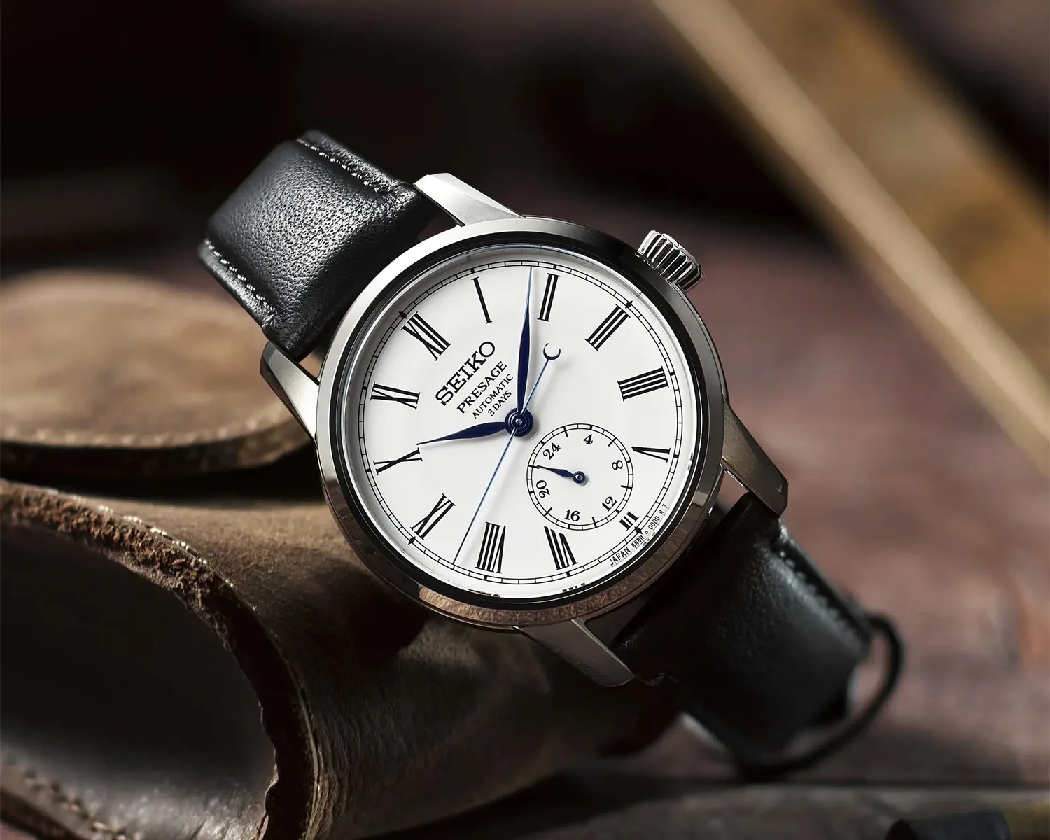 a seiko presage watch on a desk