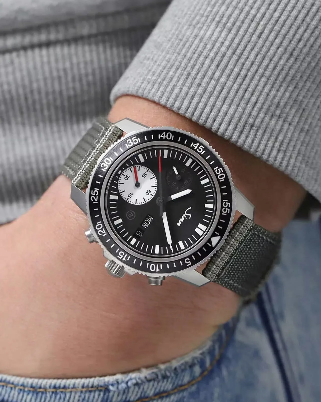 a Sinn dive watch on a man's wrist