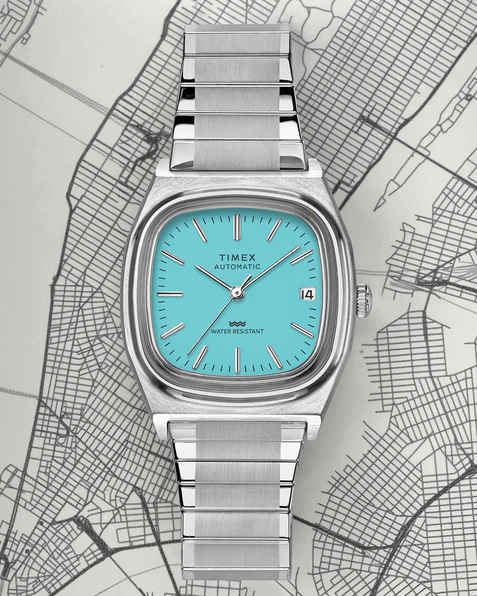 a silver watch with a light blue dial