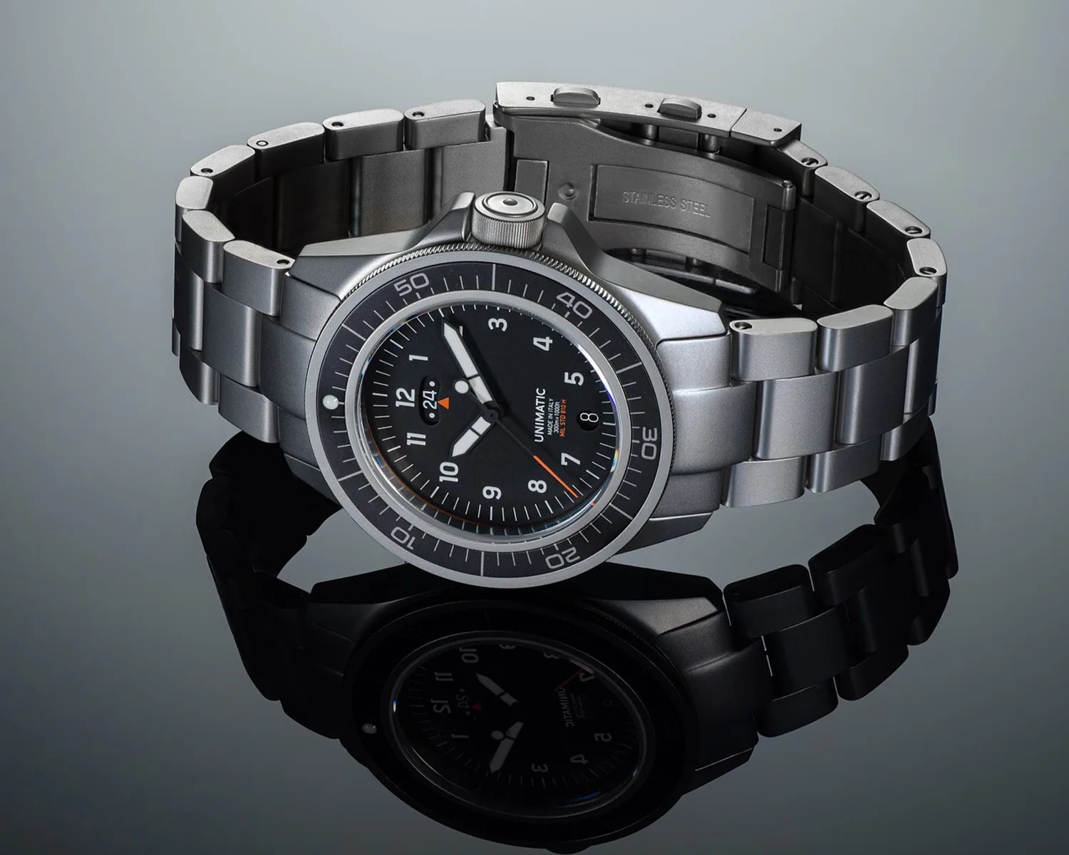 a unimatic tool watch on a bracelet