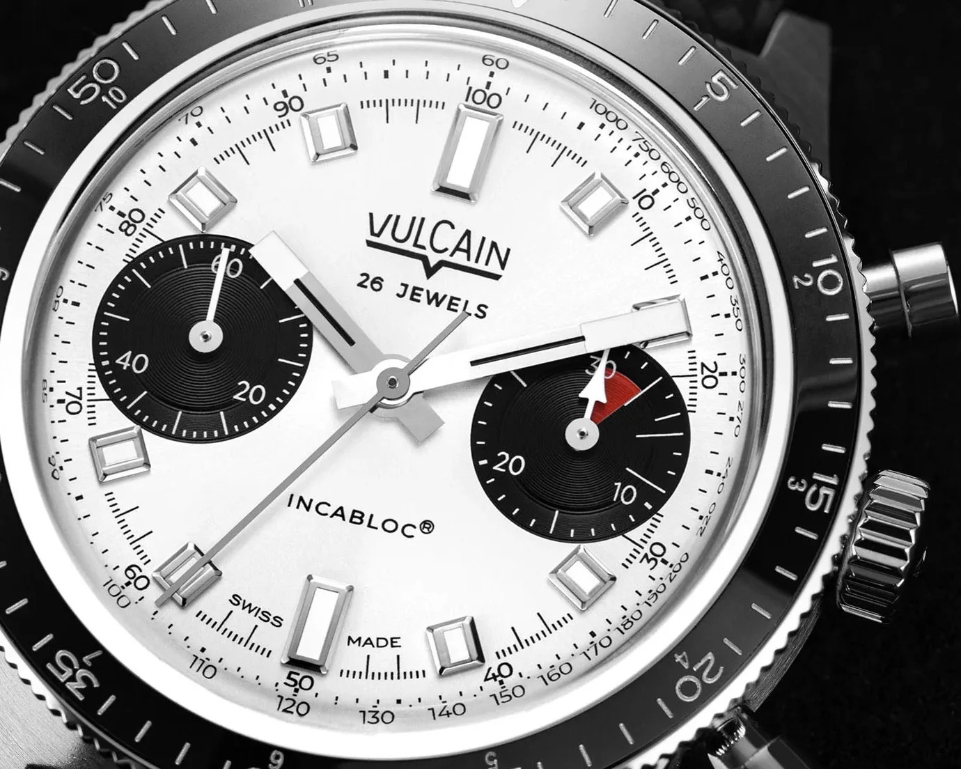 close view of a white dial on a chronograph watch