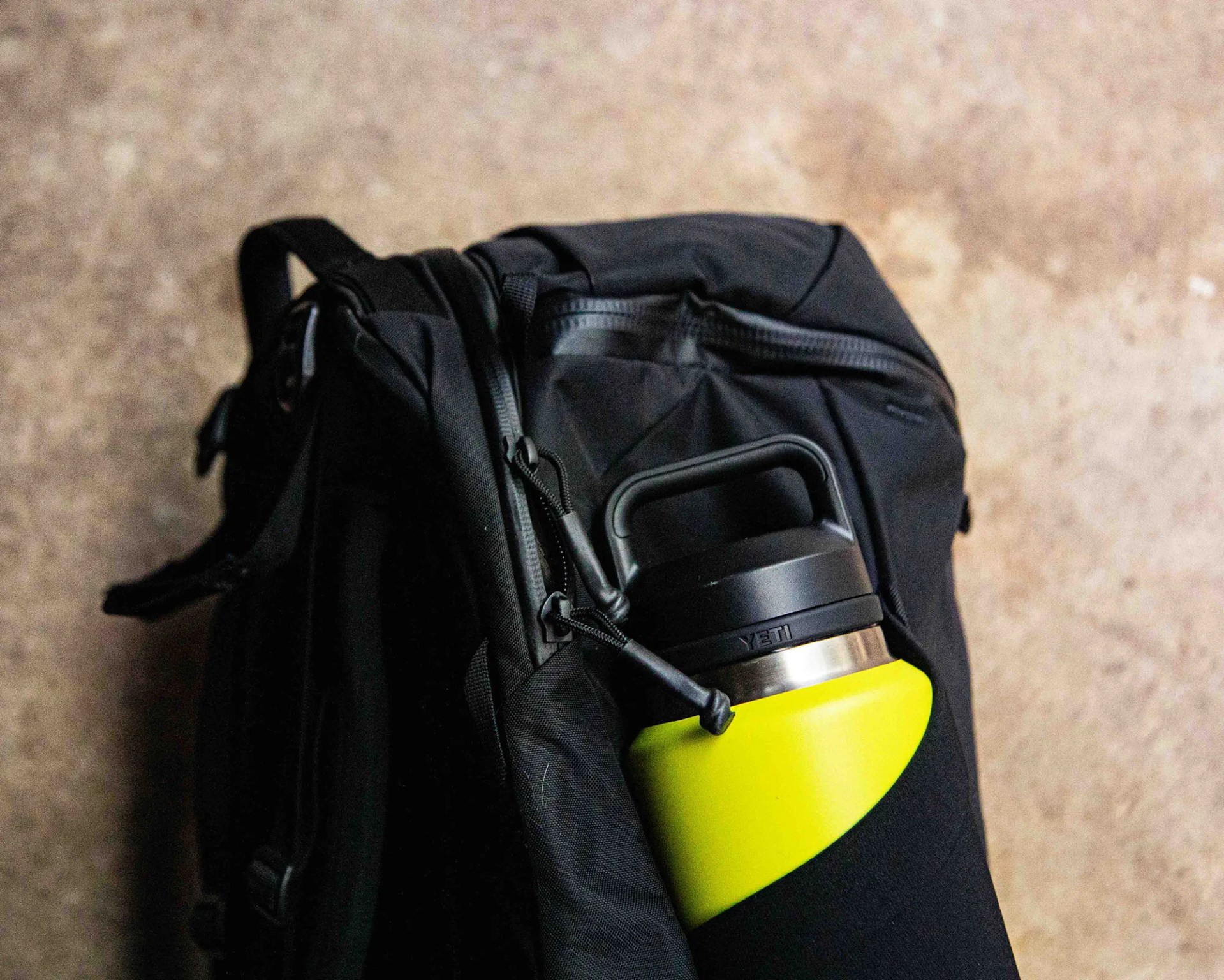 black yeti backpack with water bottle
