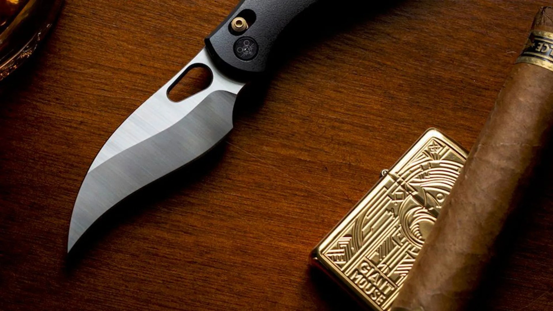 GiantMouse knife with lighter and cigar on wood desktop