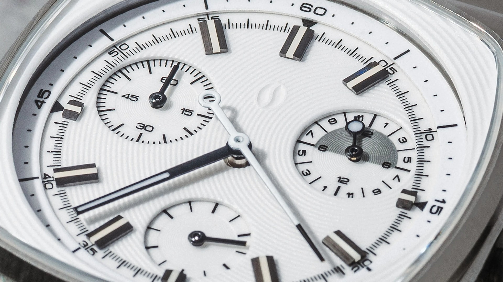 Closeup of Brew x Worn and Wound Metric Chrono Regulator Lumint watch face