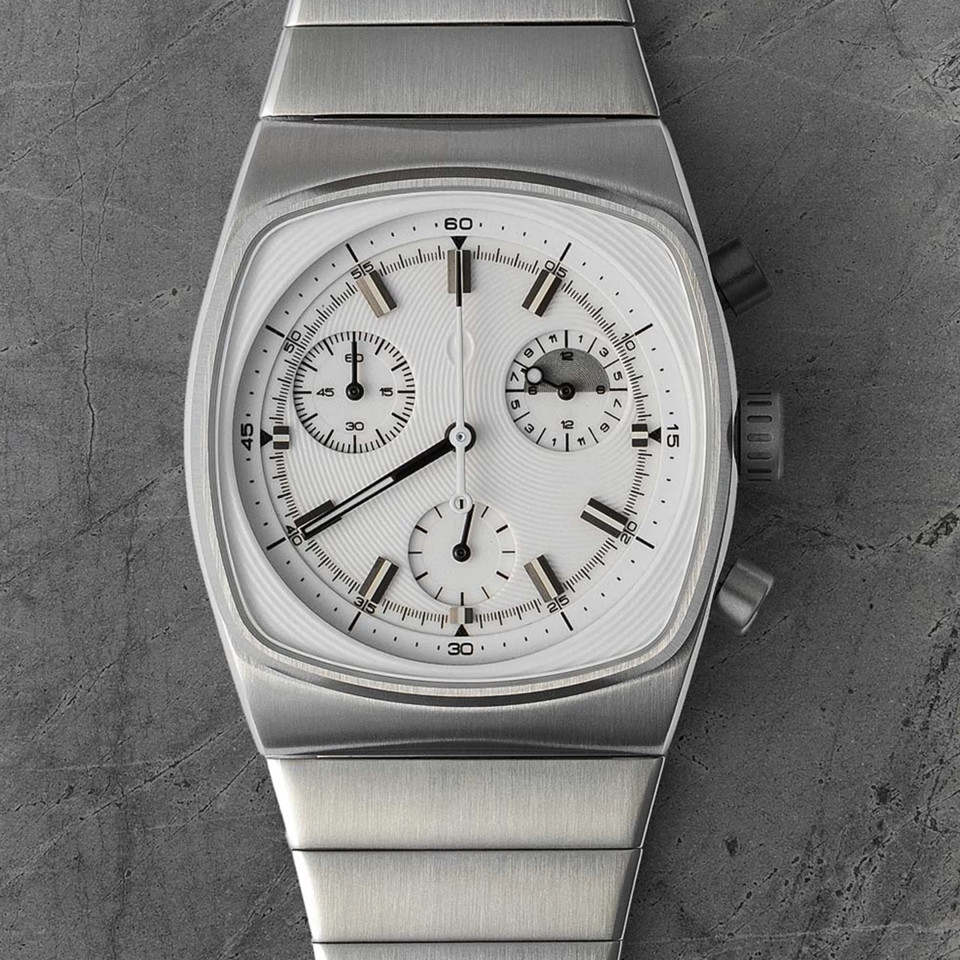 Brew x Worn and Wound Metric Chrono Regulator Lumint watch face on cement