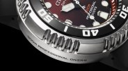 Closeup of Citizen Eco-Drive Professional Diver 300m watch case on red-black background