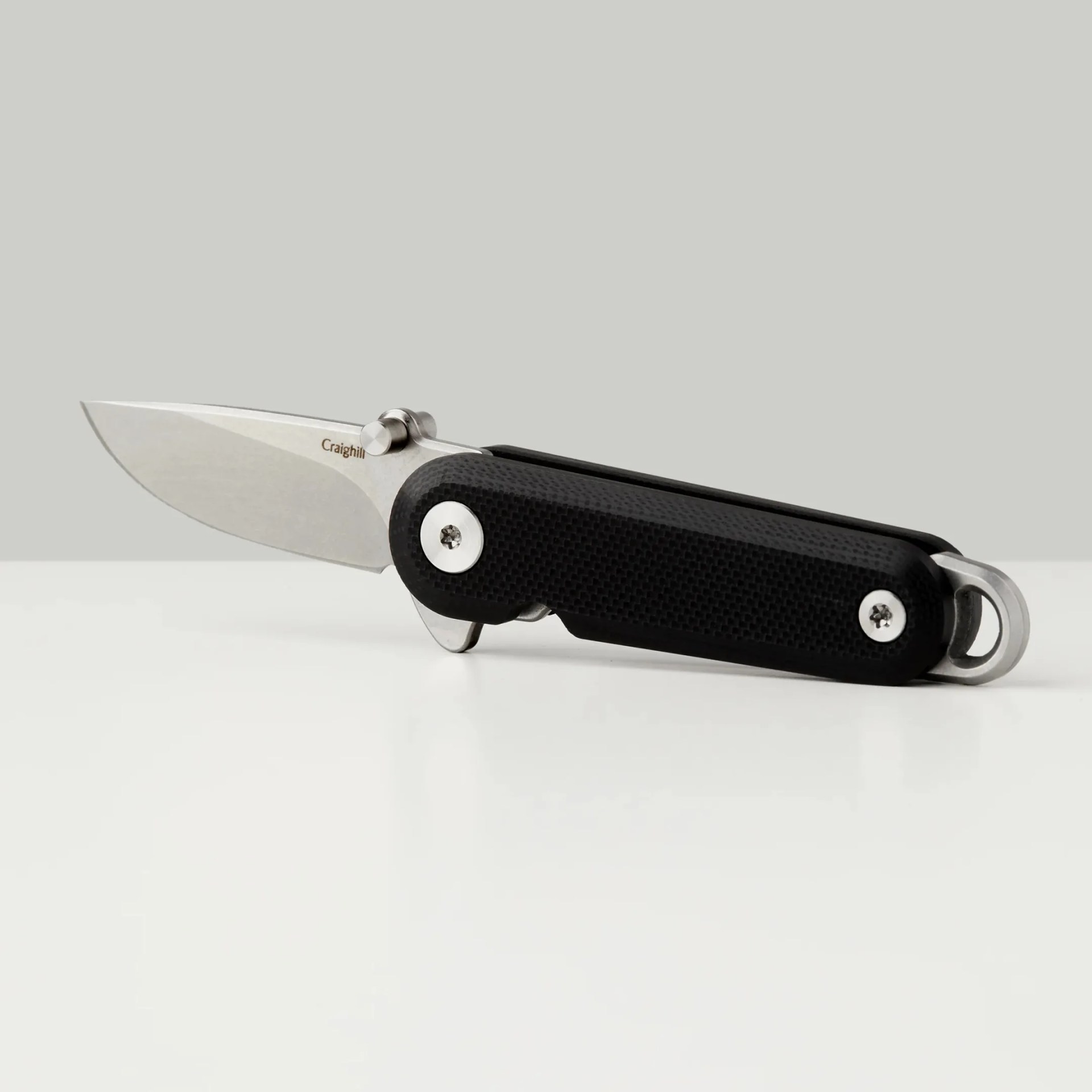 Craighill G10 Lark Knife on gray background