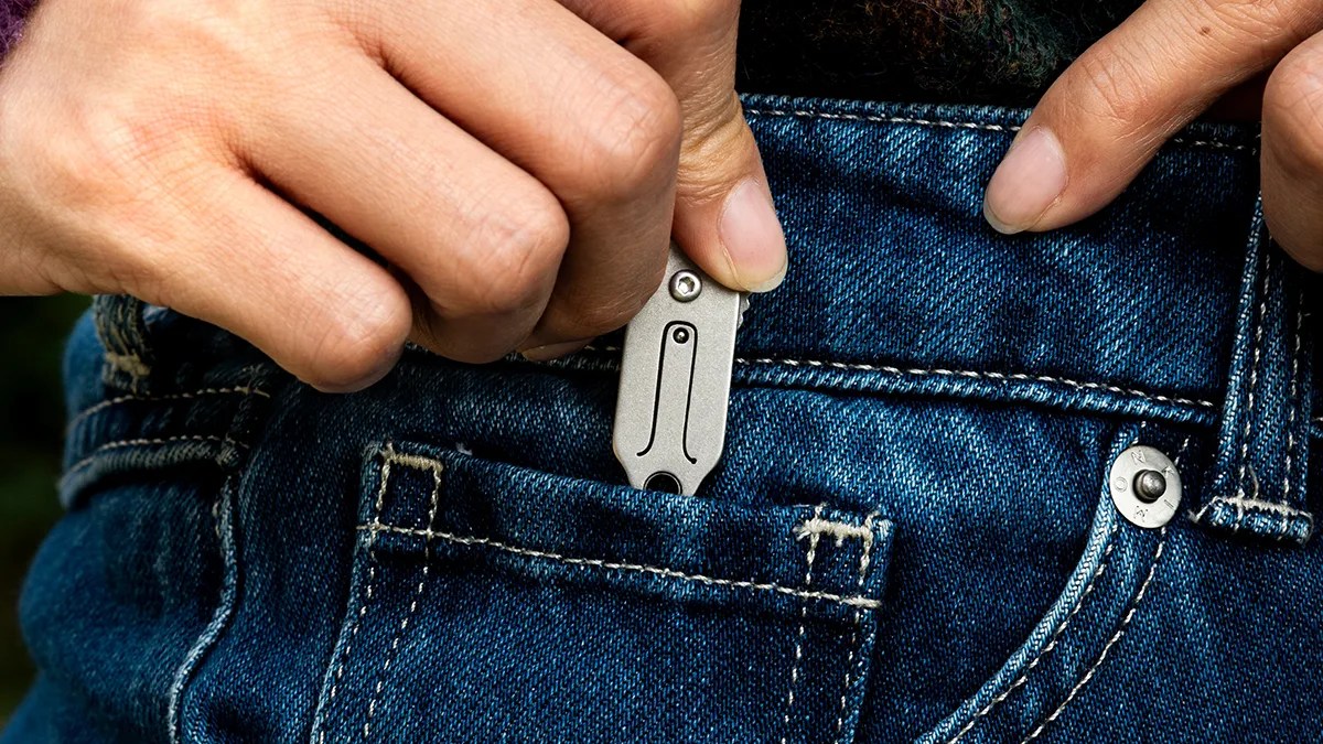 Edgelet ScytheBlade being put in jeans pocket