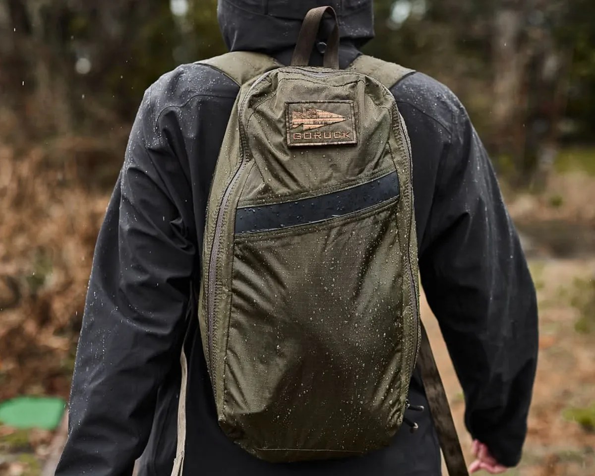 GoRuck Packable Bullet bag on person's back in the rain