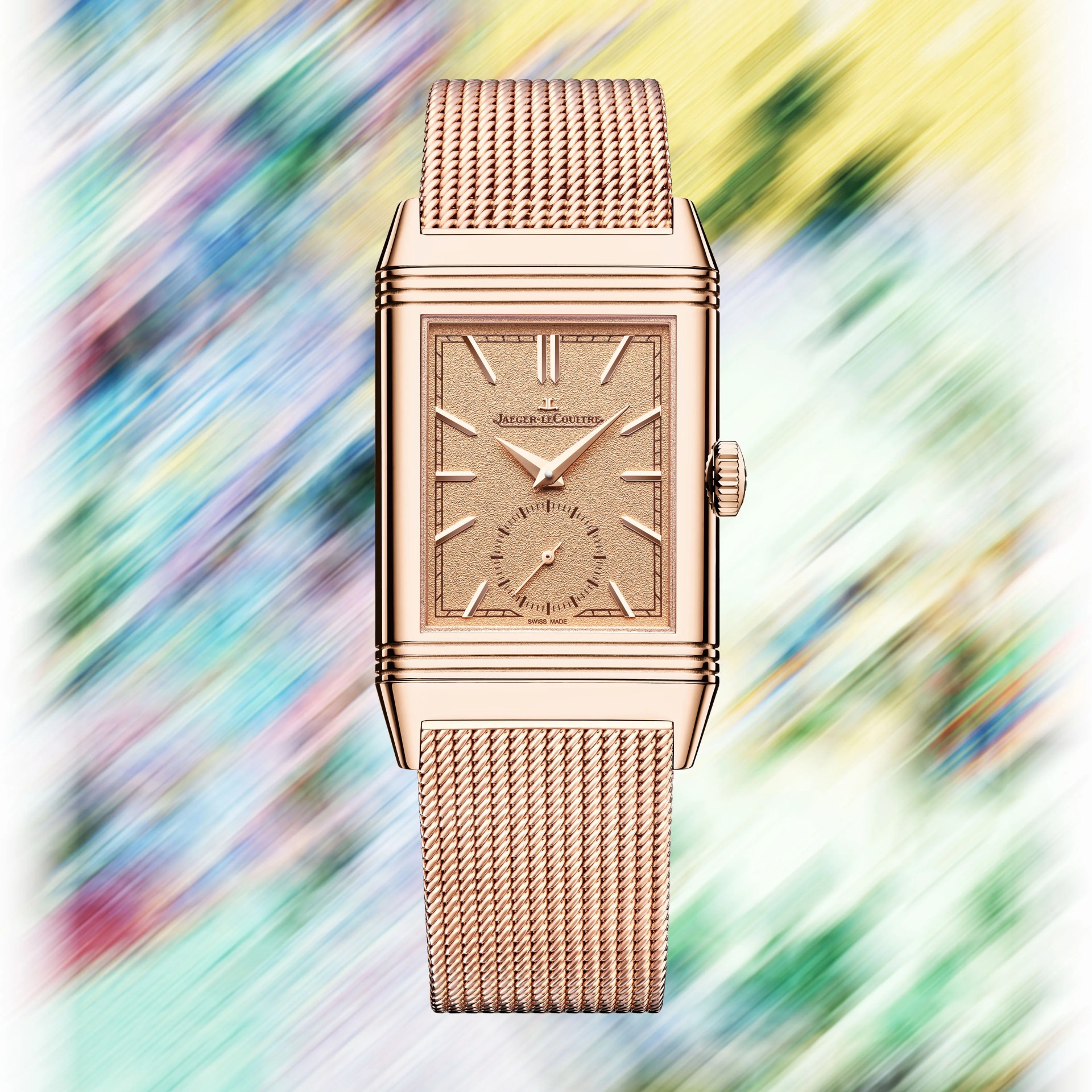 a gold watch on a blurred floral background