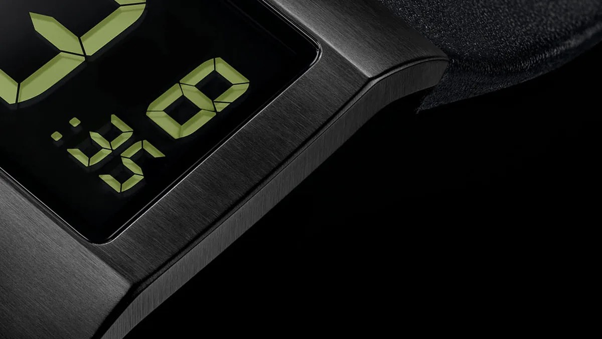 Closeup of Junghans Mega Futura watch on black background
