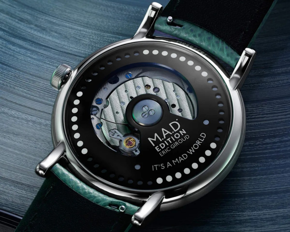 MB&F M.A.D.2 watch caseback on blue striated background