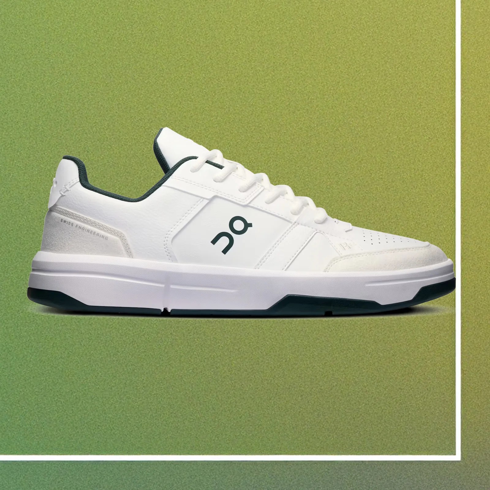 A single On THE ROGER Clubhouse revised sneaker = in white and dark forest green shown in profile against a gradient green background that looks like a tennis court.