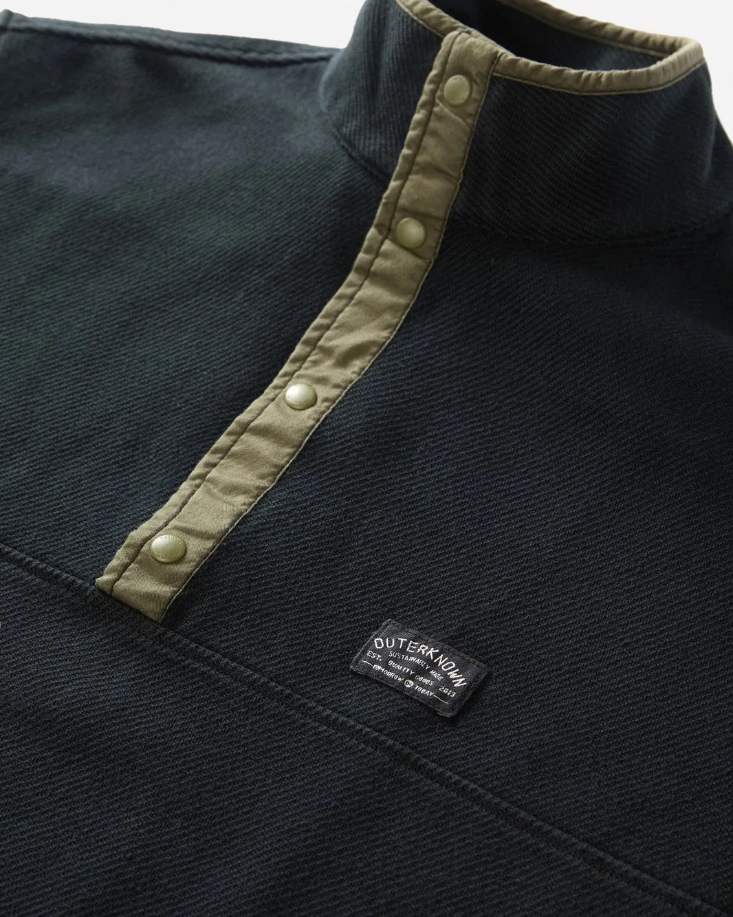 Close-up image of the snap button front of Outerknown's Blanket Shirt