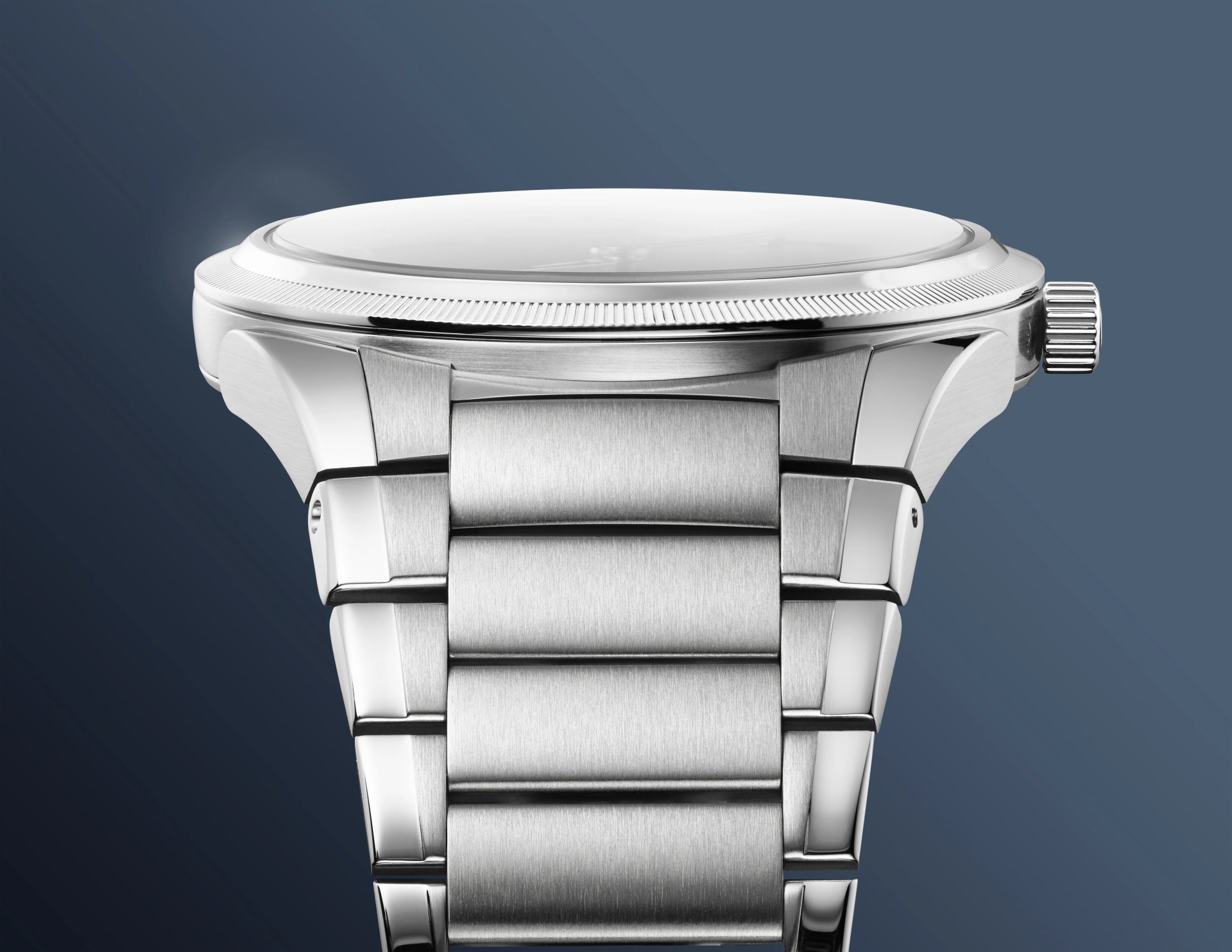 A view of running down the bracelet of the Parmigiani PF Micro-Rotor Platinum Stone Blue against a blue gradient background