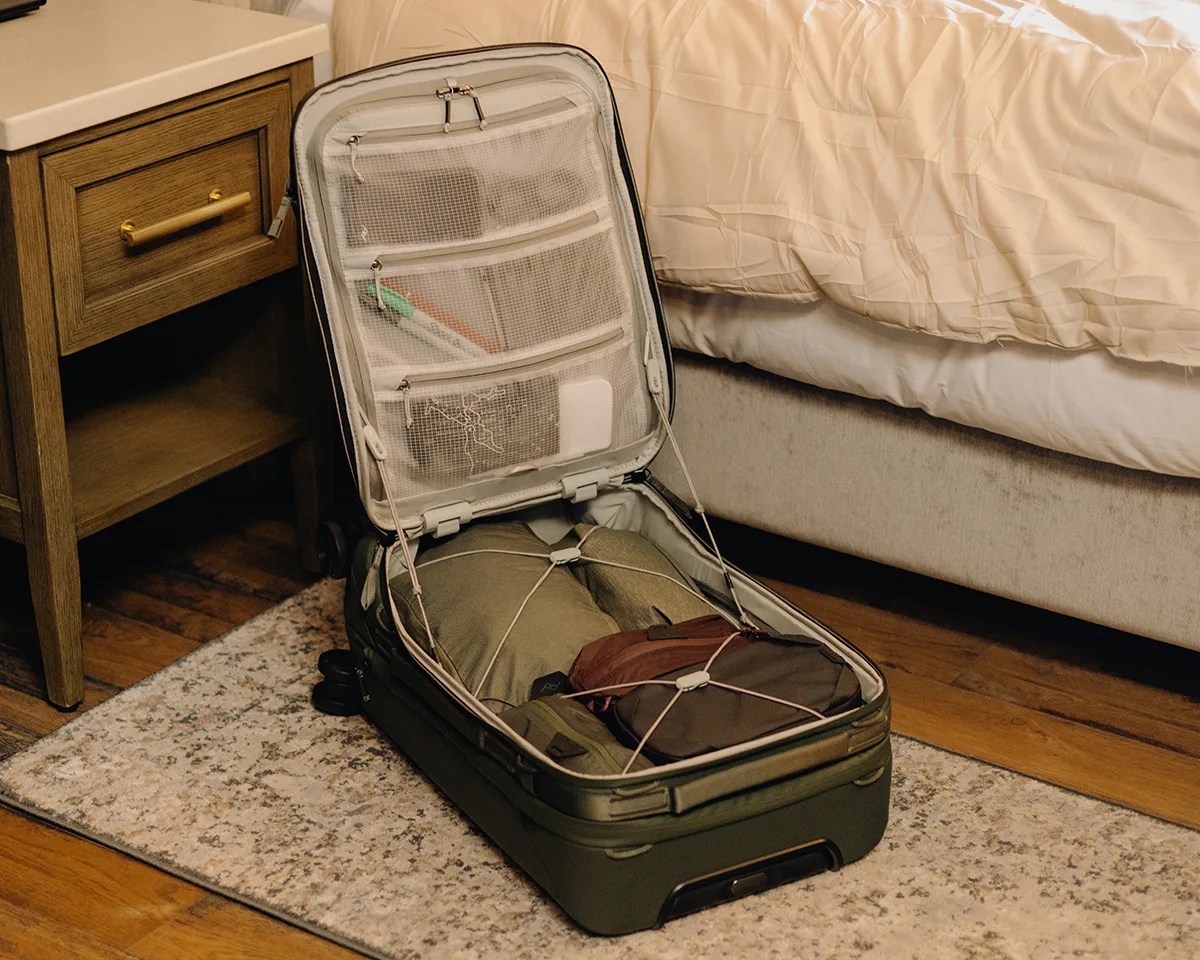 Peak Design Roller Pro Carry On bag open on hotel floor