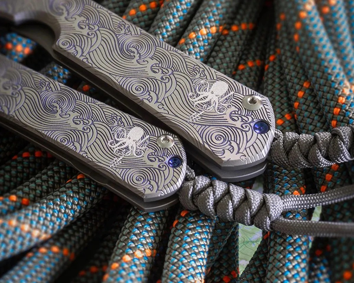 Closeup of Prometheus Design Werx SPD X CRK Sebenza 31 knife handles on climbing ropes
