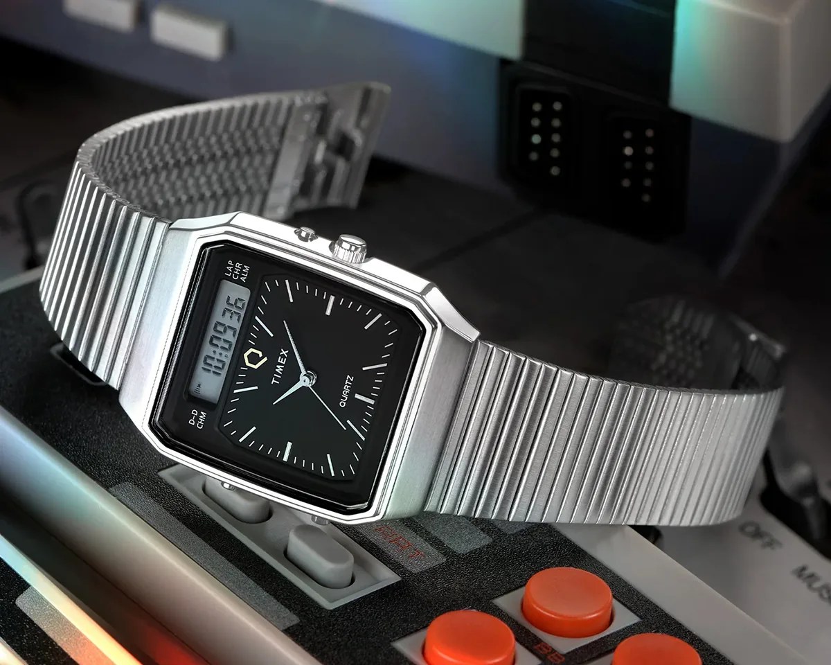 Q Timex 1982 Ana Digi Reissue watch on NES controller in front of console