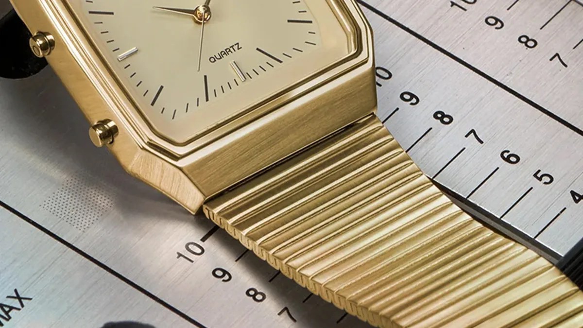 Closeup of Q Timex 1982 Ana Digi Reissue watch on audio console