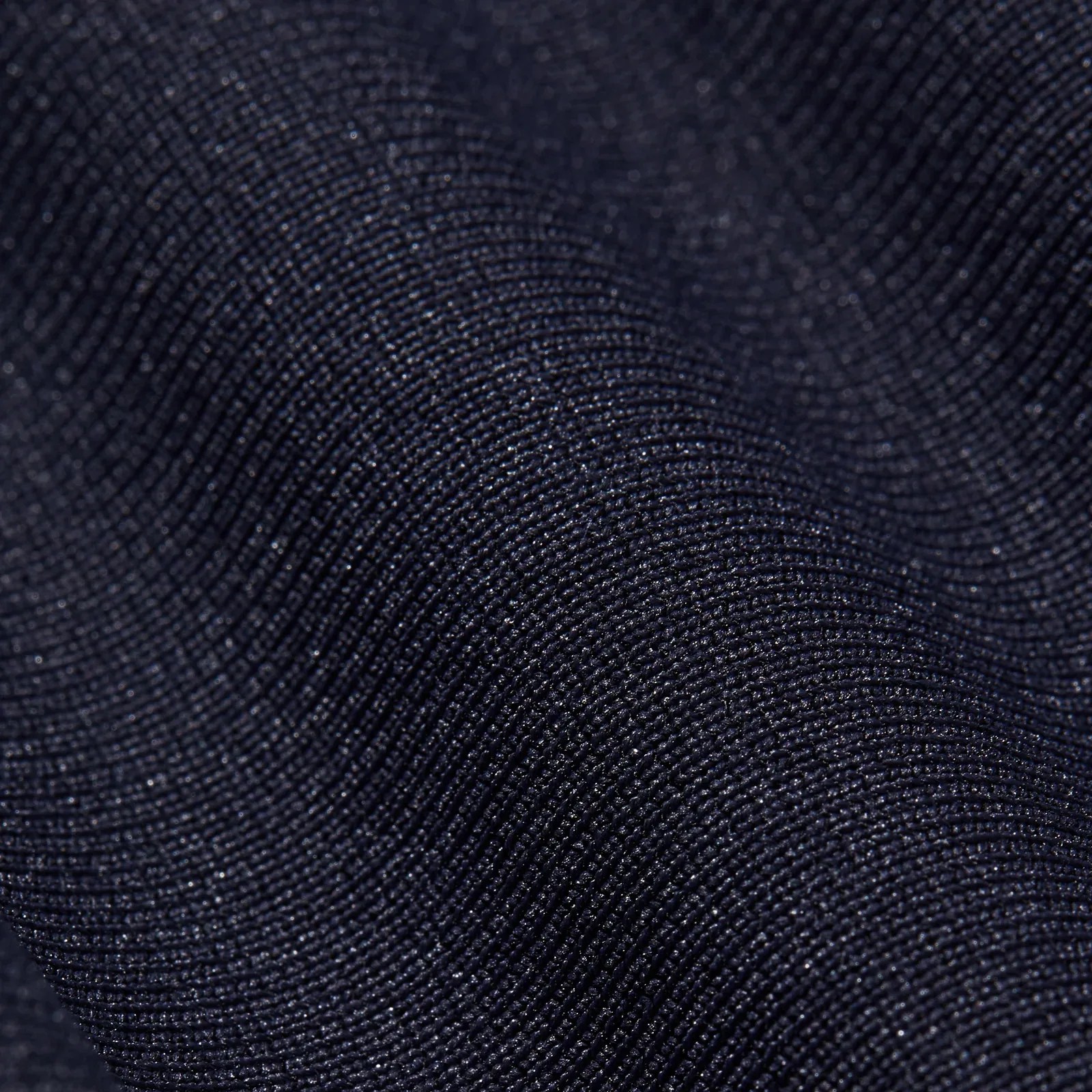 A close up view of the knitted material used to make the Rhone Commuter Pant Pro