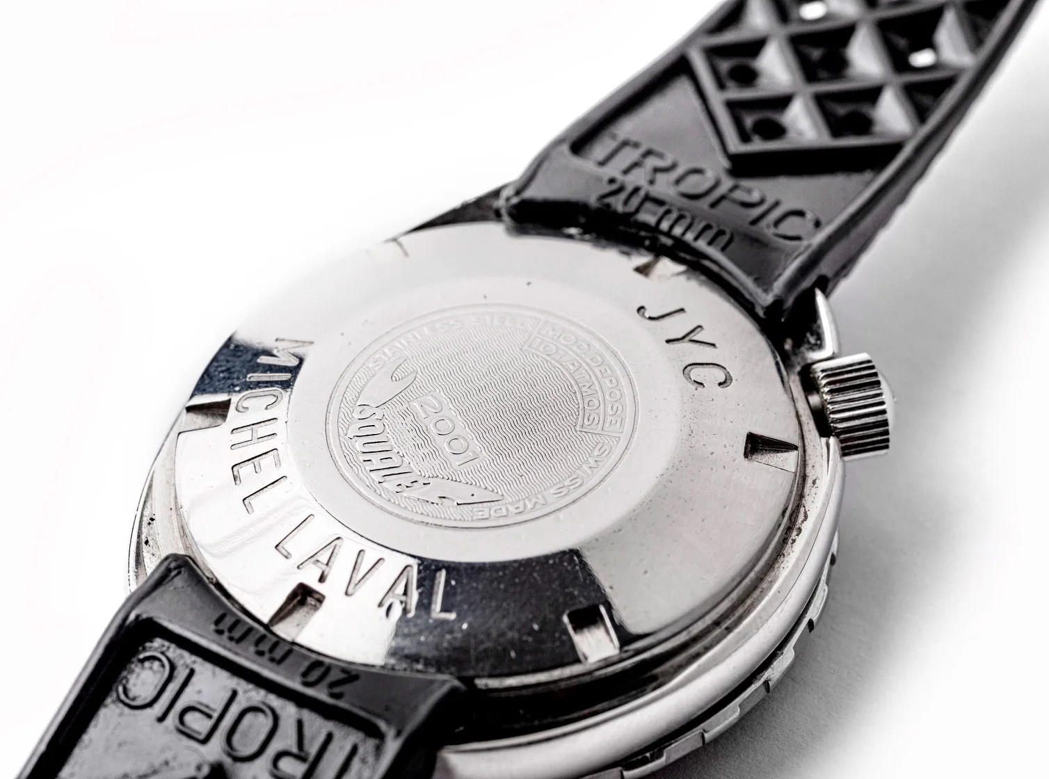 The back case of a vintage Squale 2001 dive watch. The dive watch shown was a gift from the legendary explorer Jacques Cousteau to his first officer, Michel Laval. The watch includes Cousteau's initials engraved on the back.