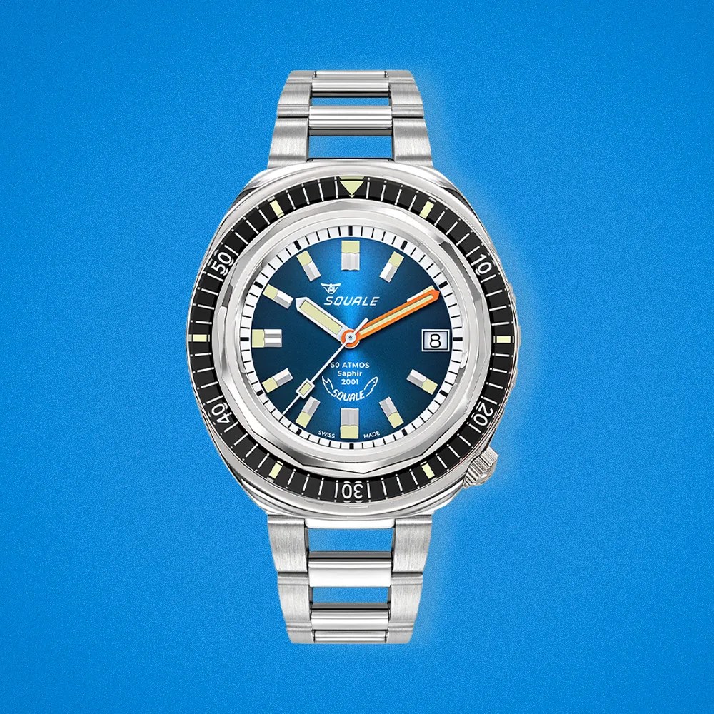 The Squale 2001 with a blue sunray dial shown head-on against a bright blue background.
