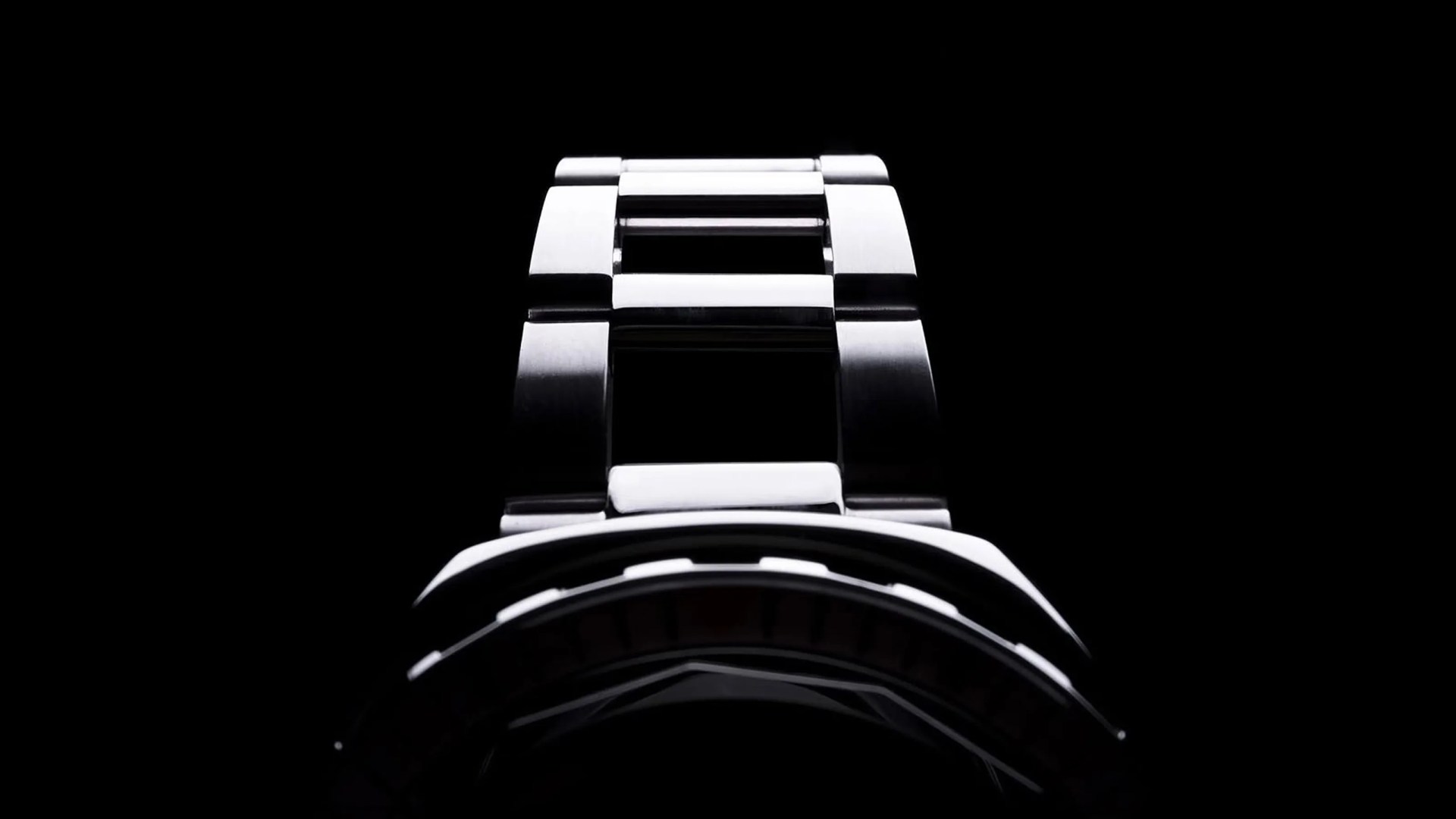 A teaser image of the Squale 2001 dive watch shown on a dark black background and shadowed