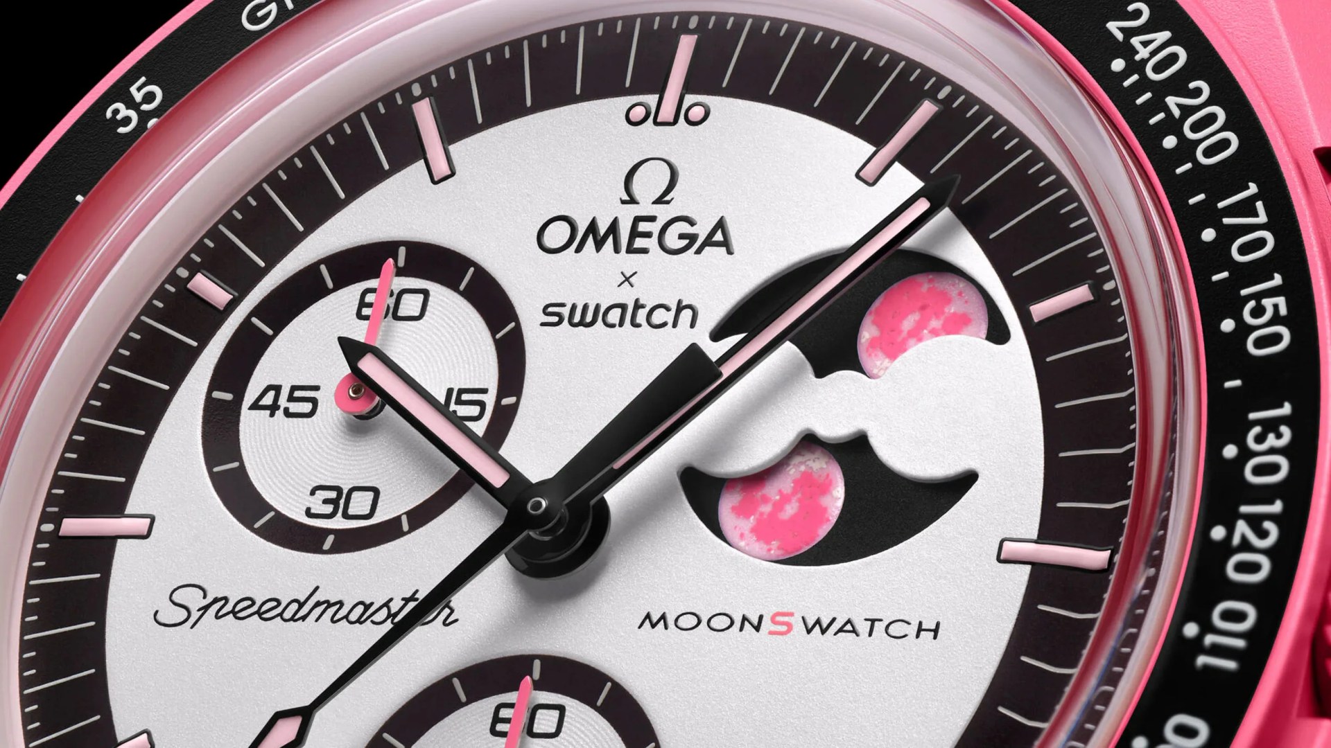 A close up of the dial of the MoonSwatch Mission to the Pink Moonphase