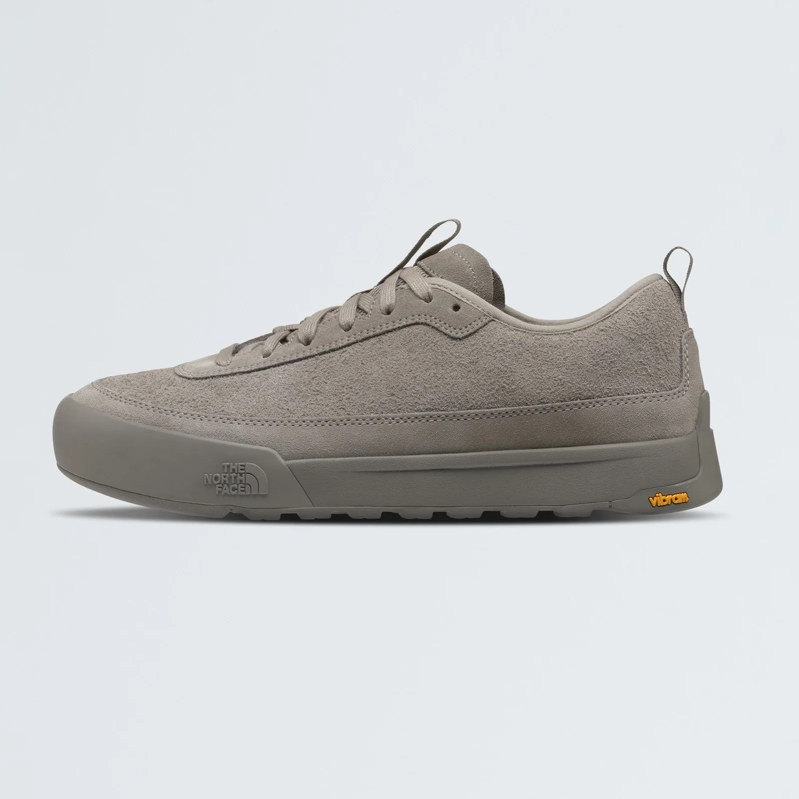 A profile view of The North Face Clyffe Suede Shoe in grey against a light grey background. 