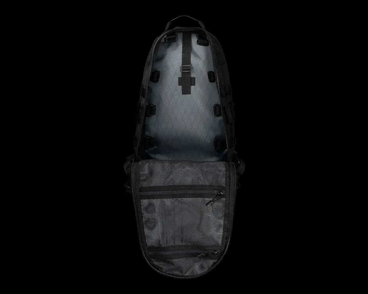 Triple Aught Design Black Magic Edition FAST Pack Litespeed backpack open on black background