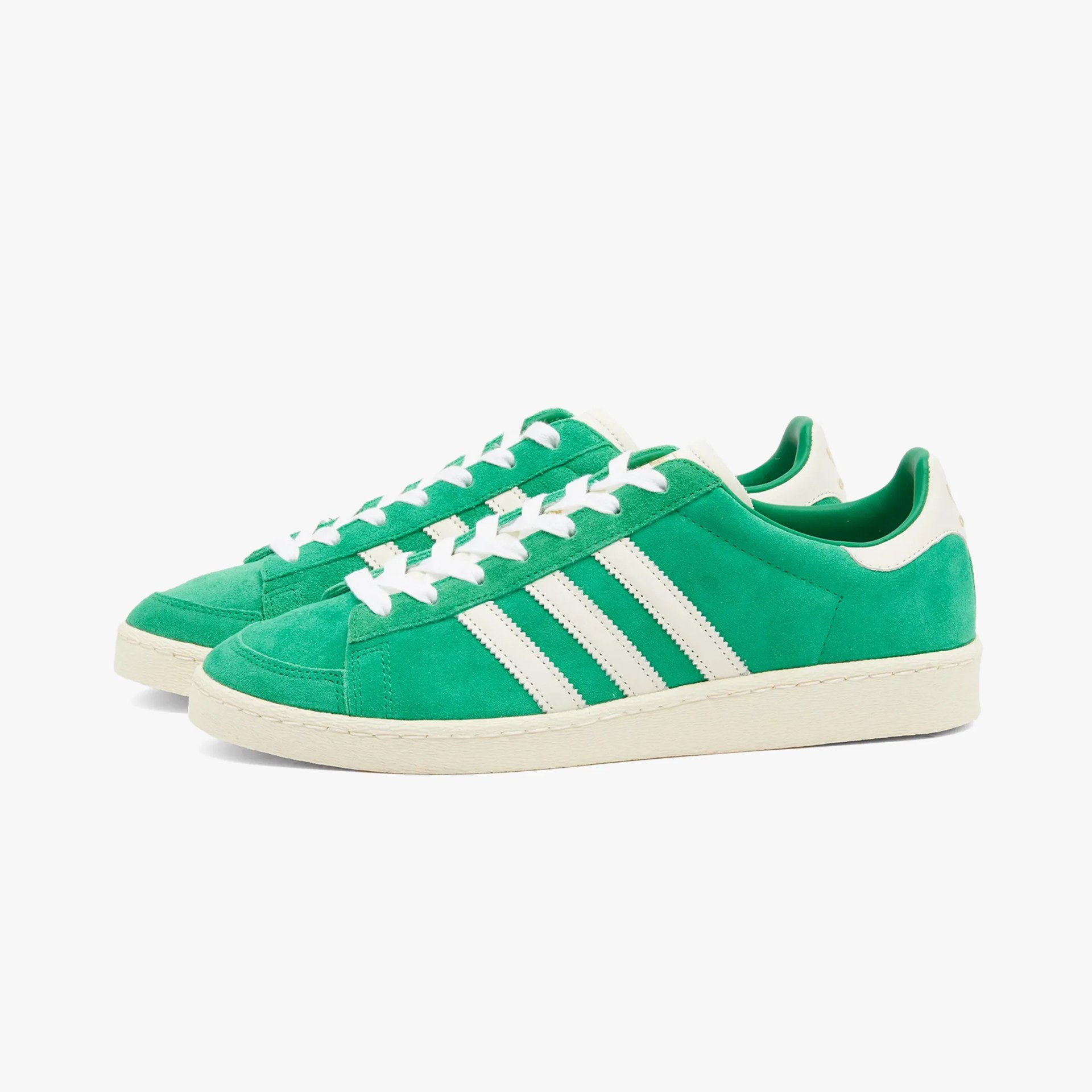 a pair of green adidas sneakers