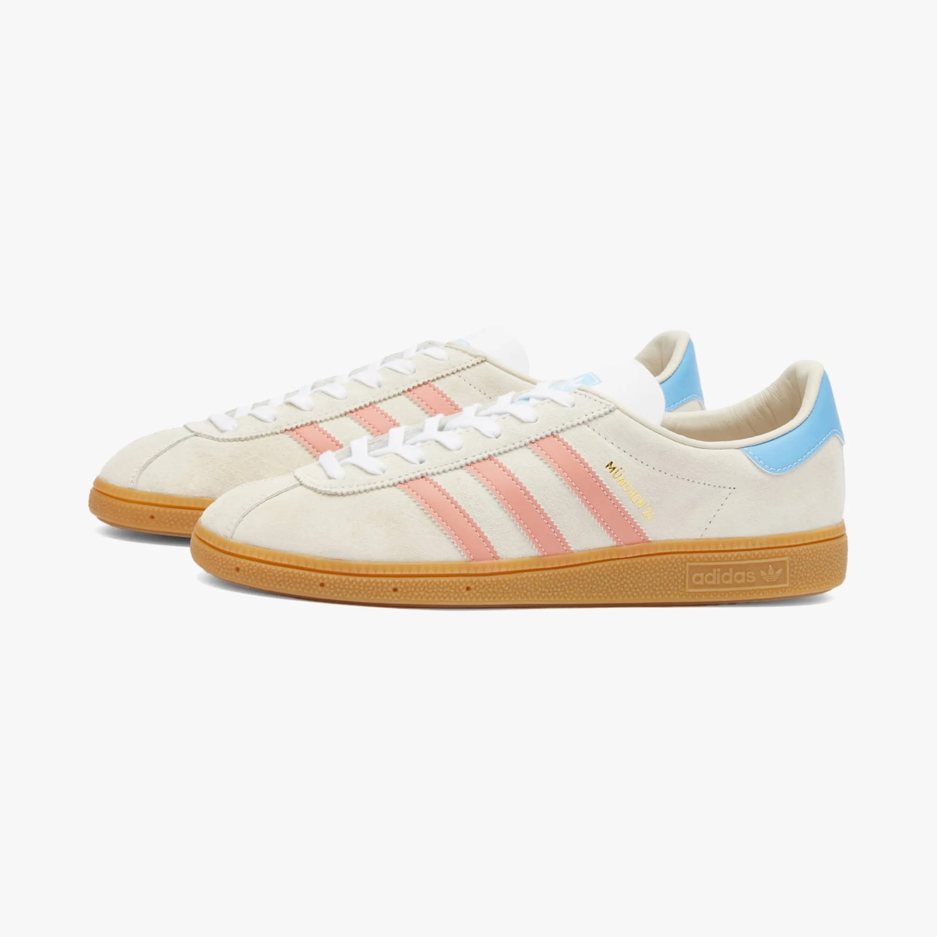 a pair of white adidas sneakers with pink and baby blue details