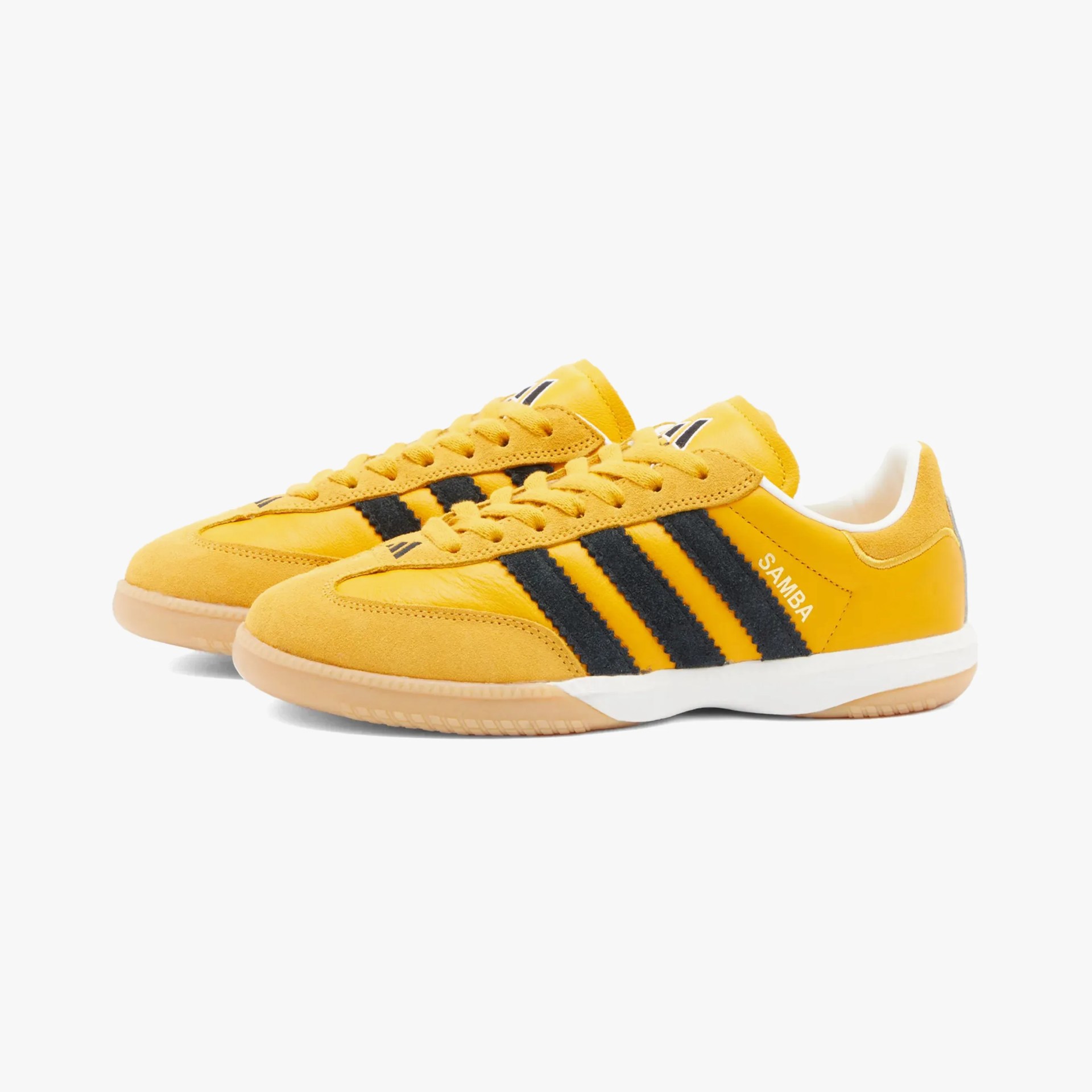 a pair of yellow adidas sneakers