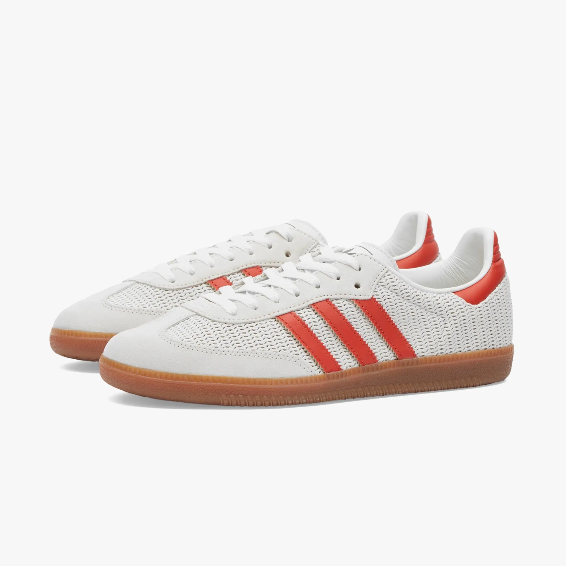 a pair of white adidas sneakers