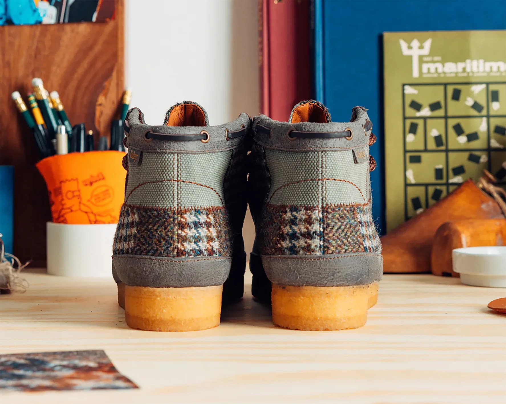 the heels of a pair of patchwork clarks wallabee boots