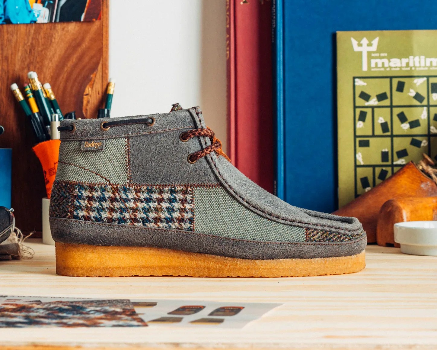 a patchwork boot on a desk