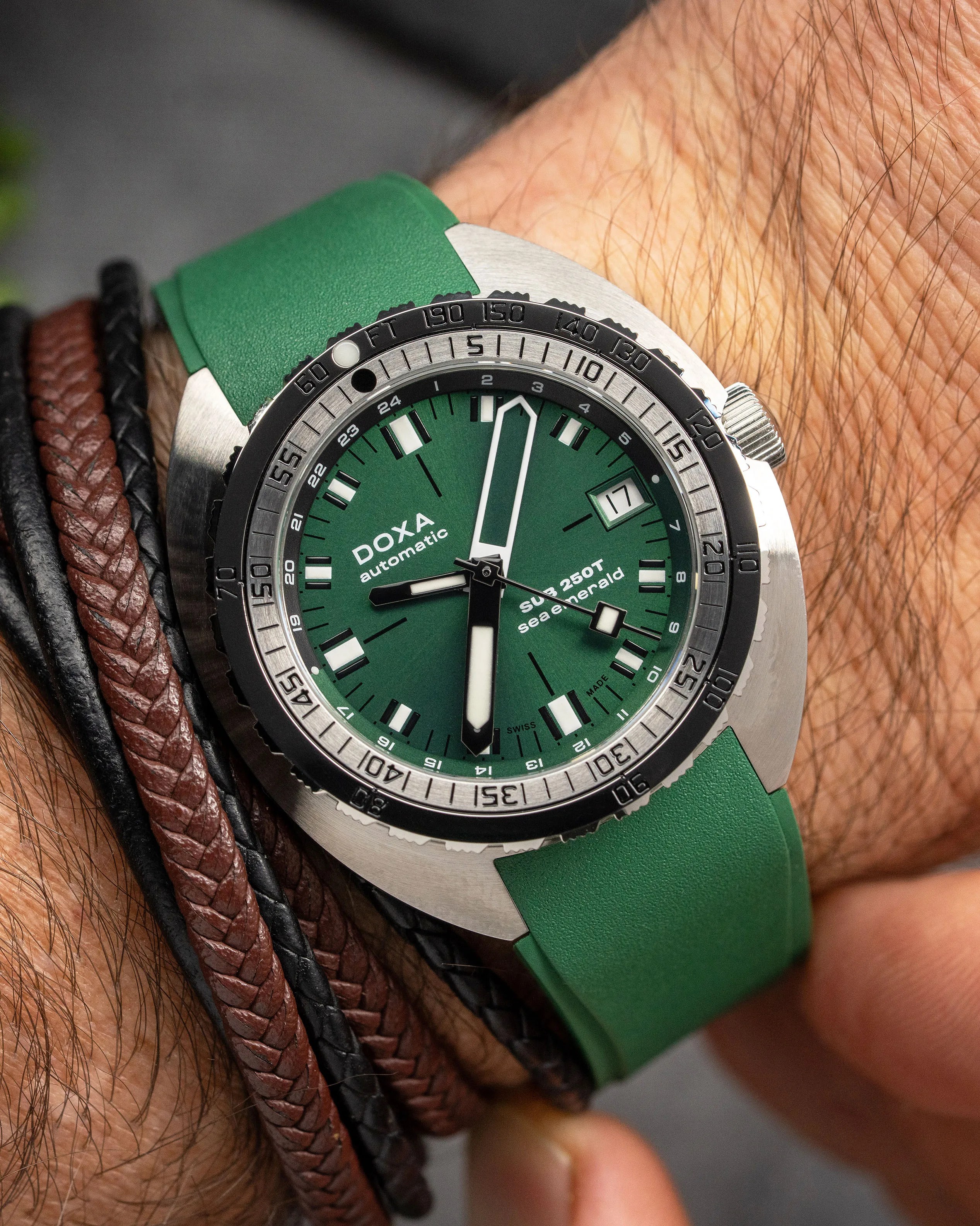 a green Doxa dive watch