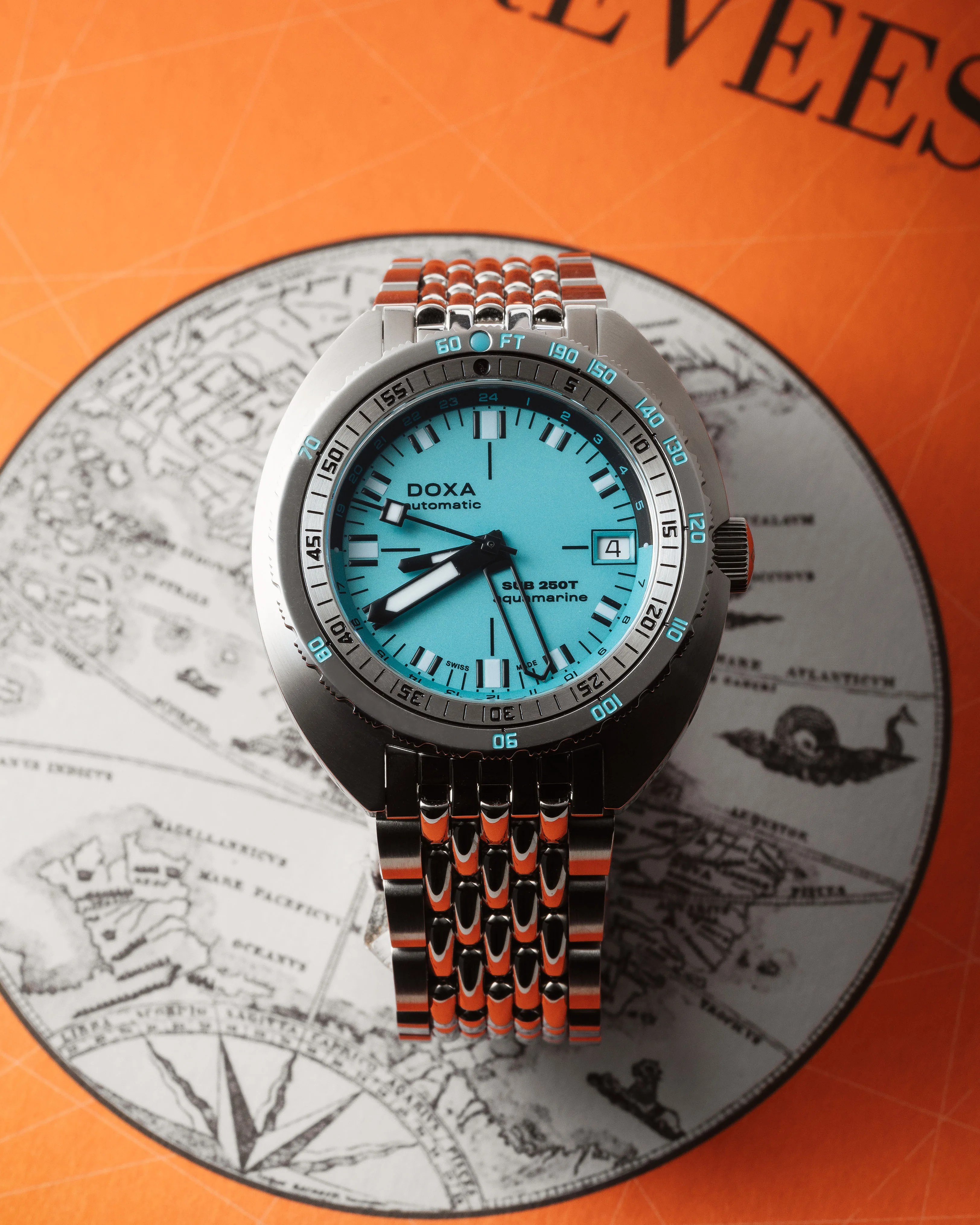 a light blue Doxa GMT dive watch