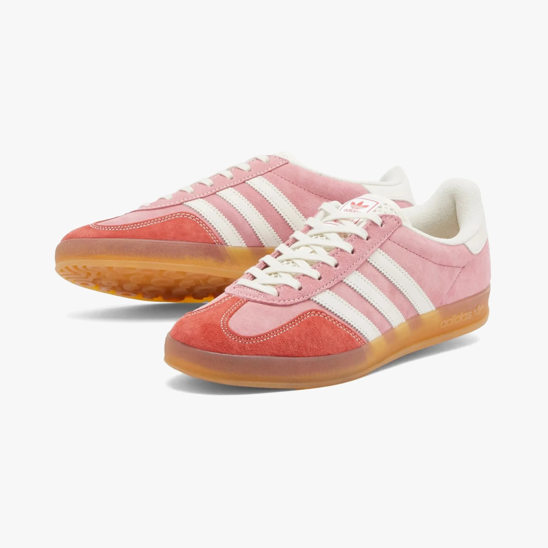 a pair of pink adidas sneakers