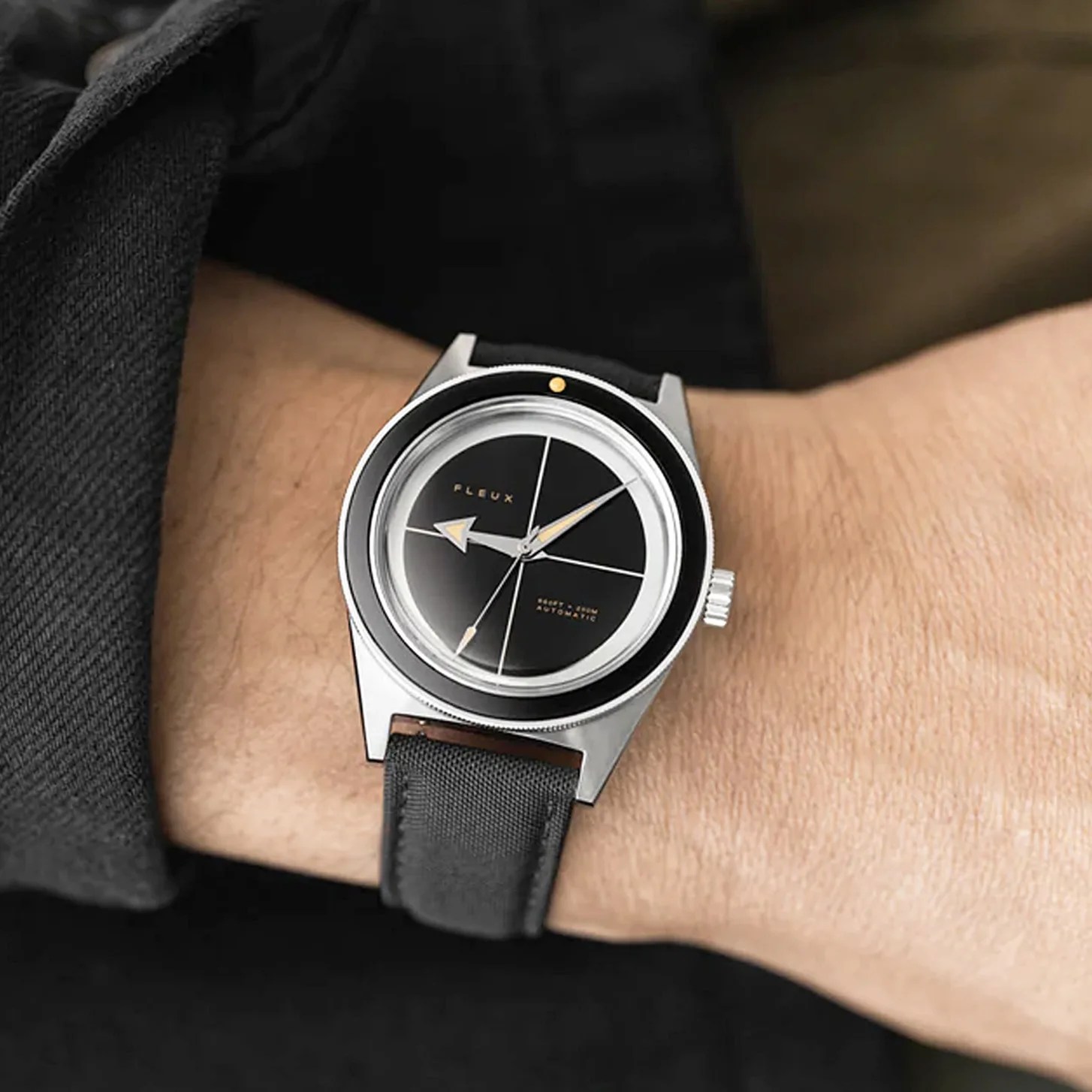 a black watch on a man's wrist