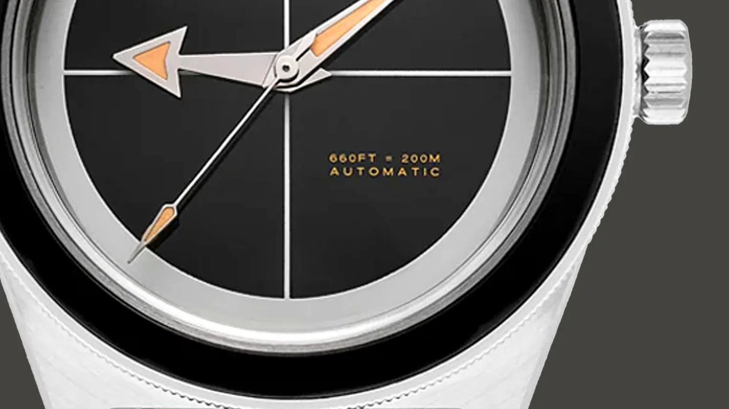 the dial and crown of a dive watch